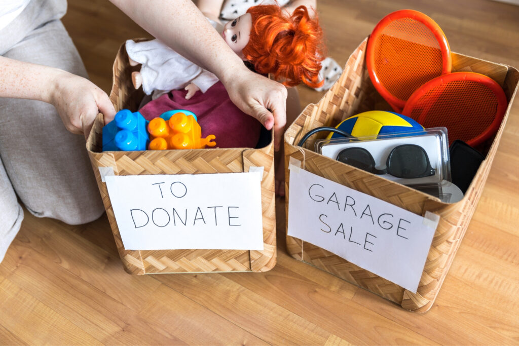 mum and kid decluttering children belongings together