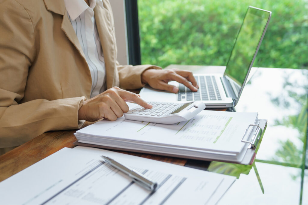 women calculating costs in detail for hidden expenses